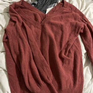 Deep v neck. Rust orange sweater. Super soft material with great stretch!